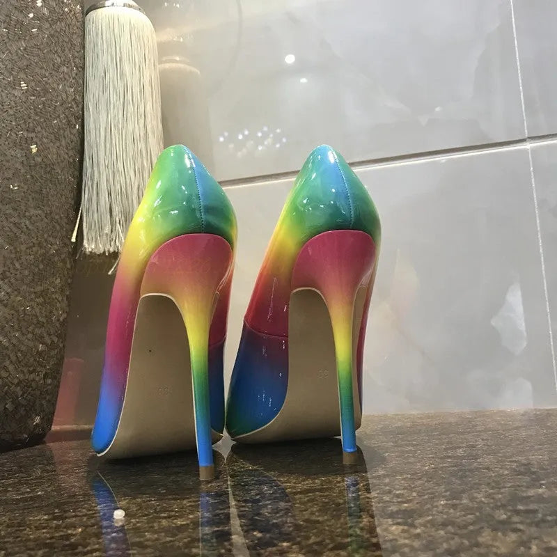 Rainbow patent leather women's ultra-high heel pointed toe stiletto pump shoes on white background