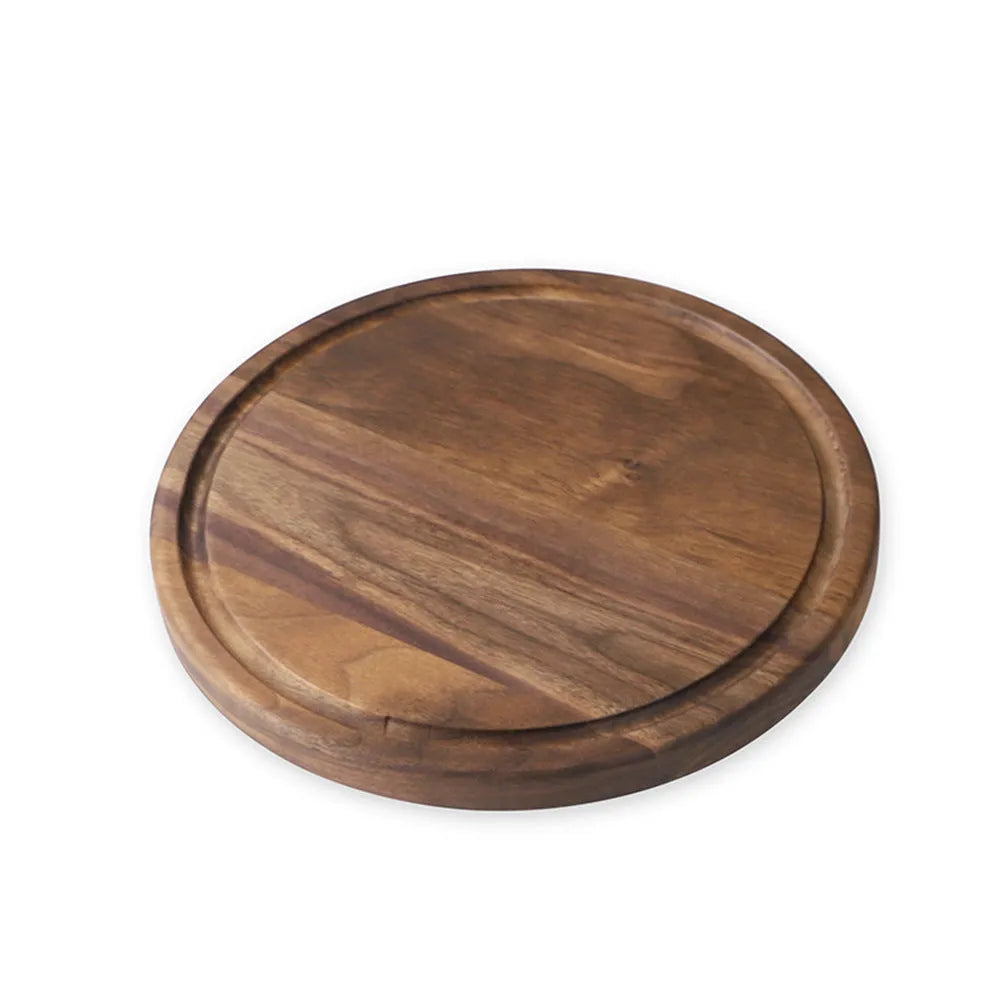 Black walnut wood cutting board with groove edge, rectangular shape, on kitchen counter