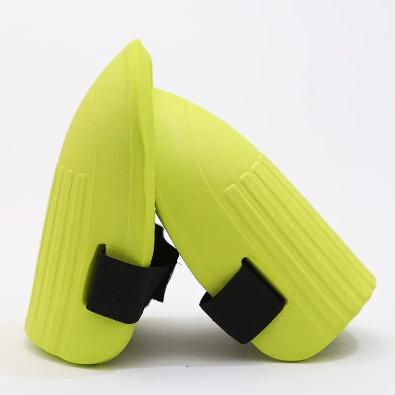 A pair of thick black EVA foam knee pads for gardening and DIY work.