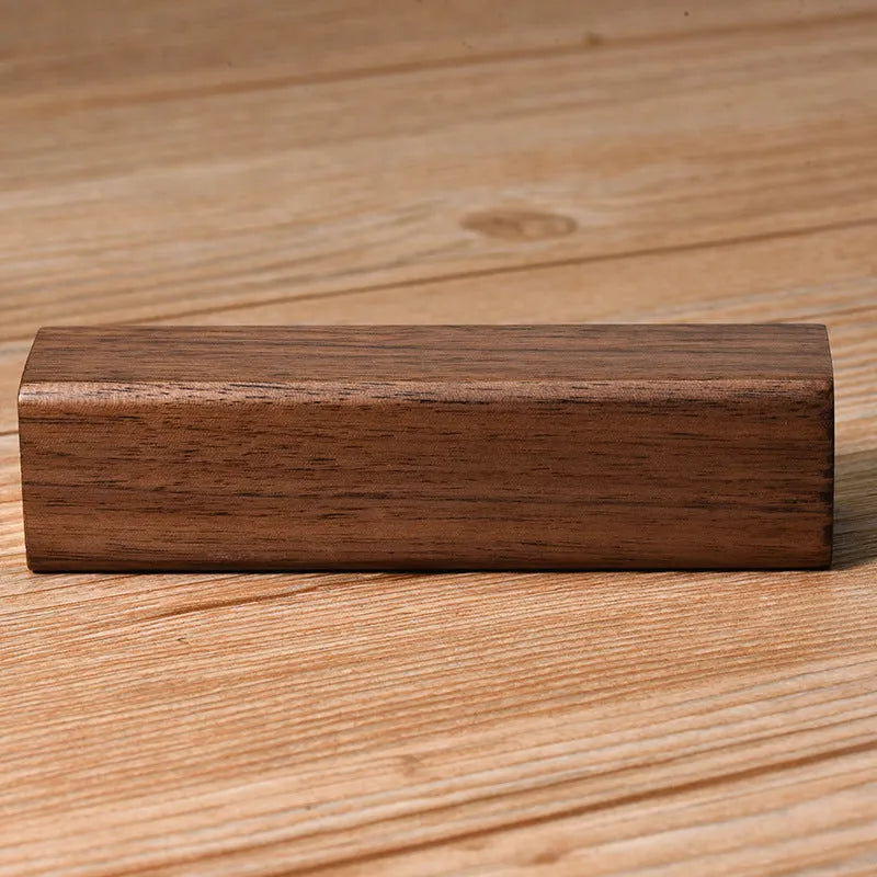 Portable black walnut solid wood power bank with 2000mAh capacity, brown colour, 100mm cylindrical design
