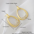 Women's yellow gold geometric drop earrings with simple zircon detail showing oval and round design elements