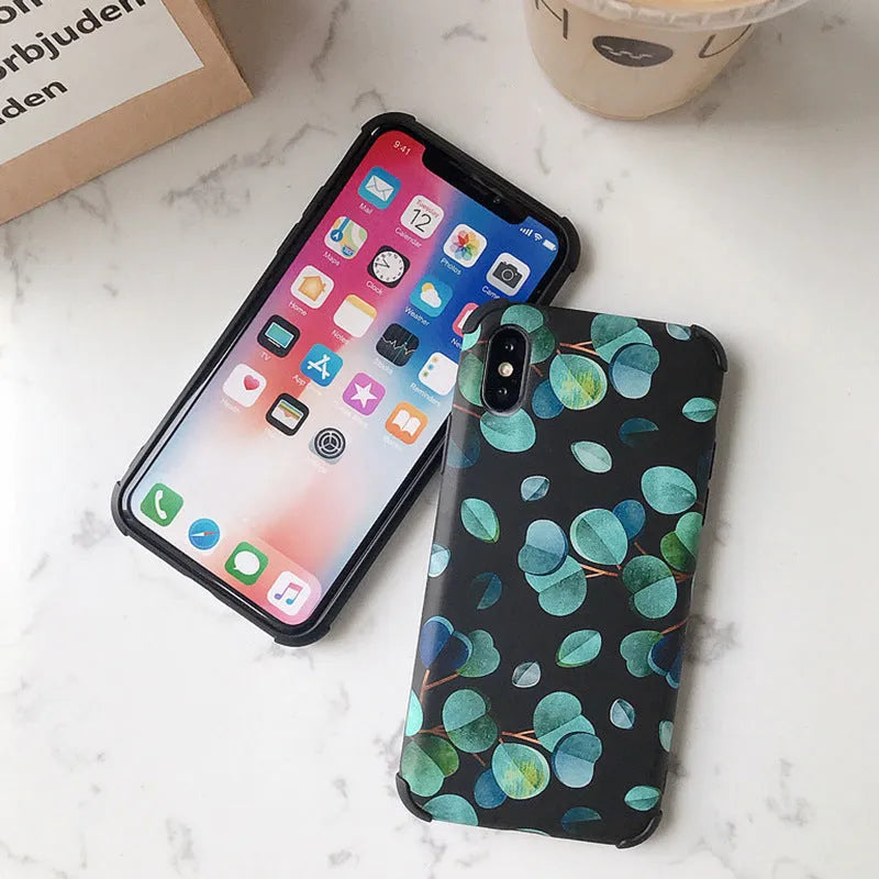 Black silicone iPhone case with a raised leaf pattern on the back.