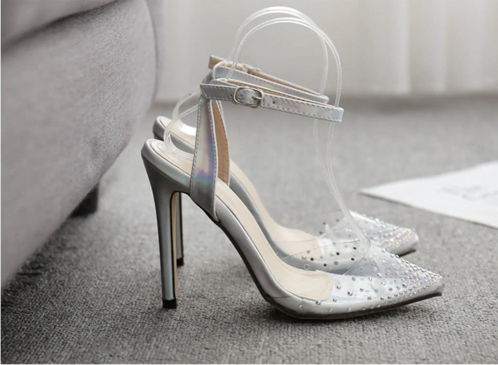 Women's pointed toe diamond sandals with a stiletto heel and PVC upper.