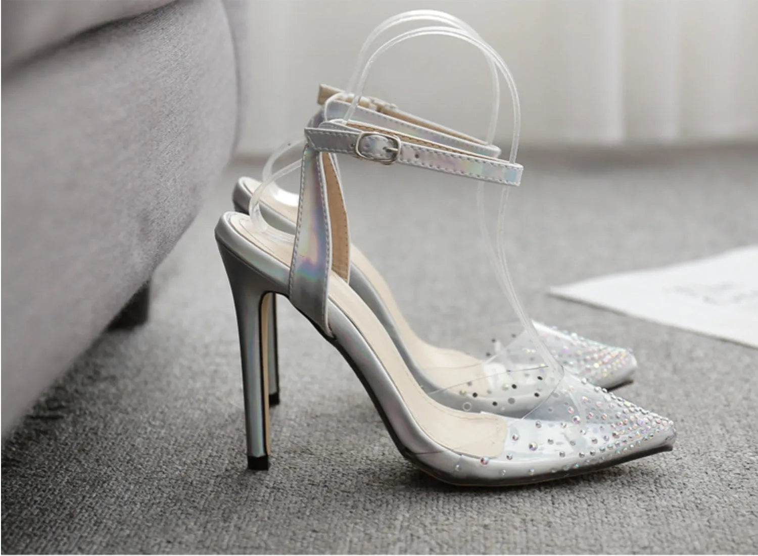 Women's pointed toe diamond sandals with a stiletto heel and PVC upper.