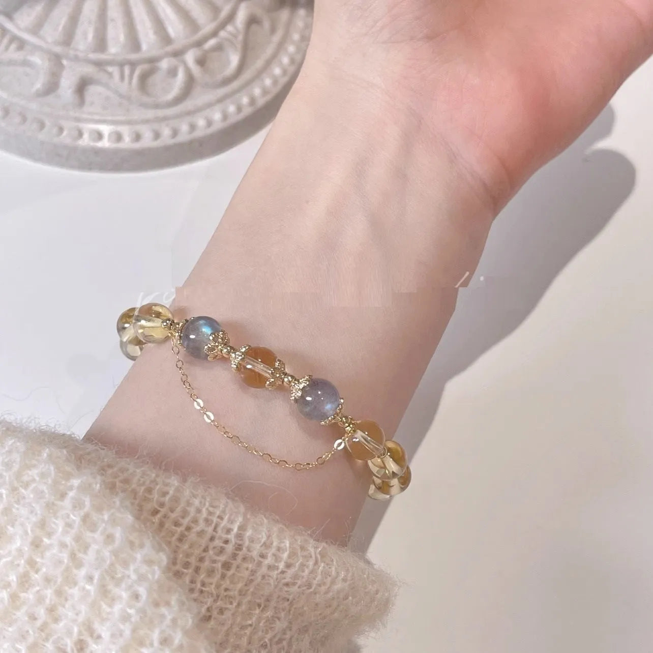 Chinese style crystal bracelet with 14K gold electroplating and citrine moonstone beads in diamond shapes