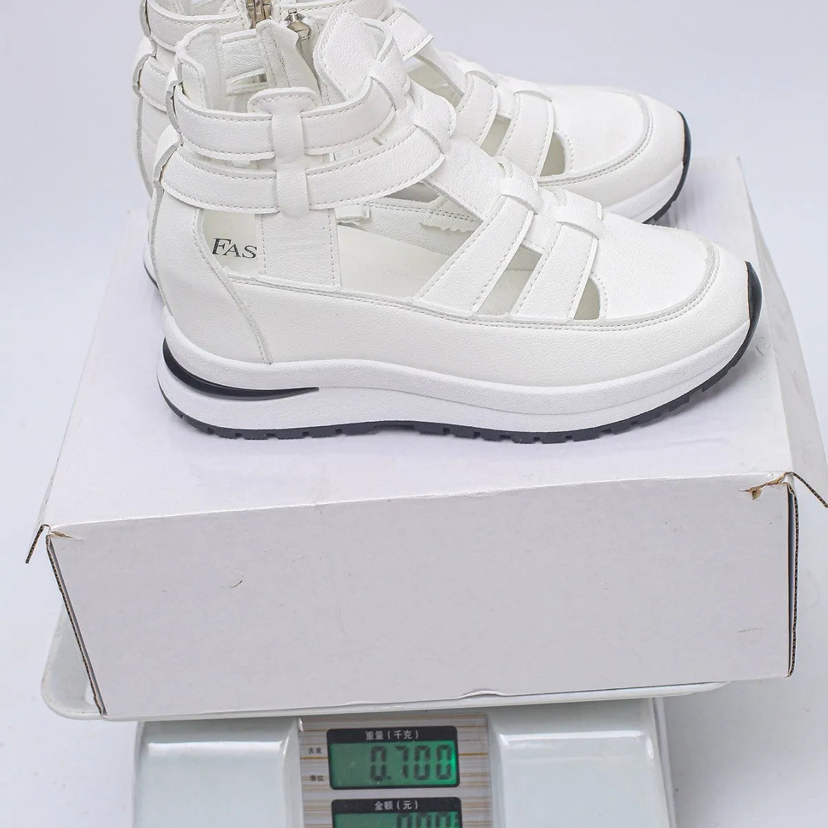 Women's black close-toed platform sandals with hollow-out design and Velcro strap.