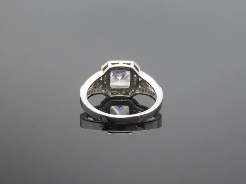 Geometric zircon ring with hollow quadrilateral design in platinum colour on copper band