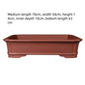 Rectangular purple clay flower pot showing handmade construction and multiple size options