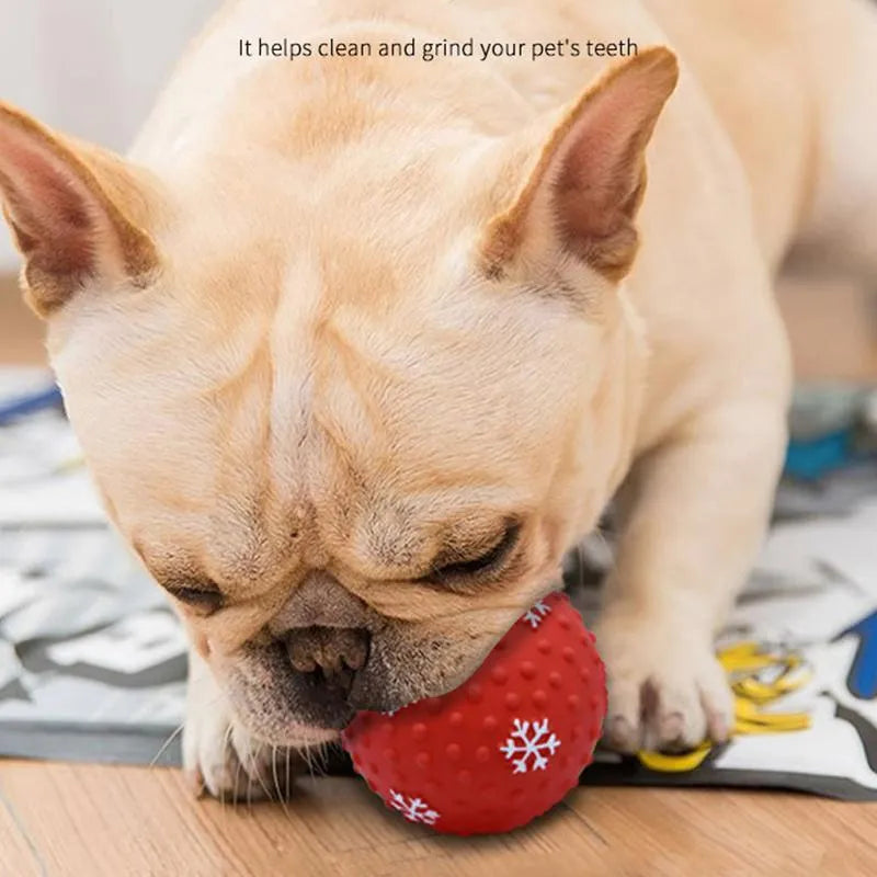 Red and green festive dog toy balls with snowflake patterns, 7cm diameter, with squeaker and air vents