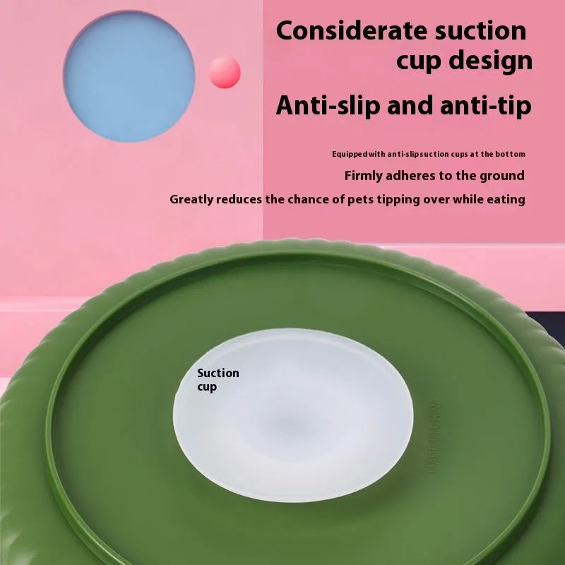 Rotating plastic pet slow feeder bowl with silicone anti-choke mat in windmill pattern.