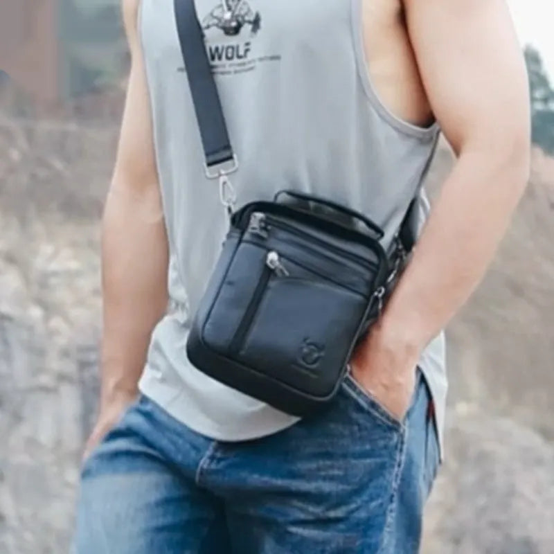Men's black genuine leather shoulder messenger bag with retro style on a plain background