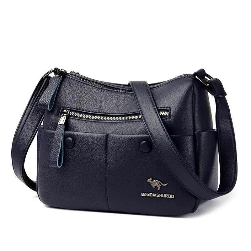 Soft PU leather crossbody bag in horizontal square shape with stitching detail, showing multiple colour options black dark blue wine red yellow.