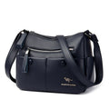 Soft PU leather crossbody bag in horizontal square shape with stitching detail, showing multiple colour options black dark blue wine red yellow.