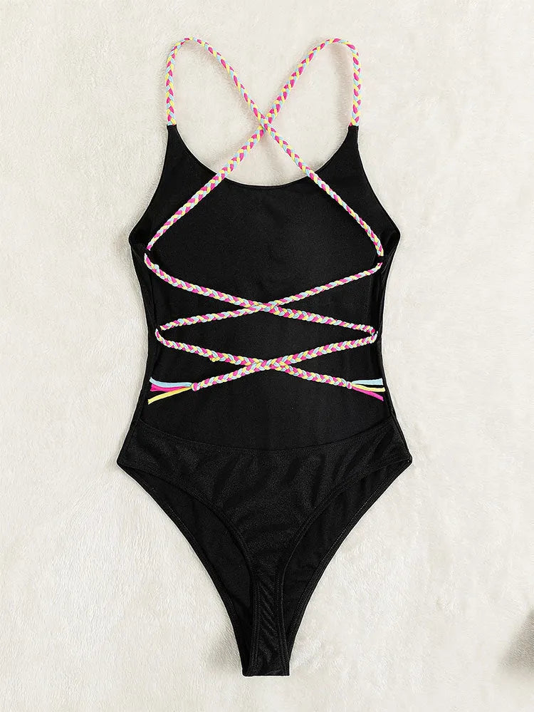 Women's one-piece solid colour backless nylon swimsuit in black, front view