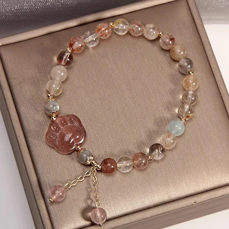 Single circle coloured hair crystal bracelet with zircon butterfly motif on light background