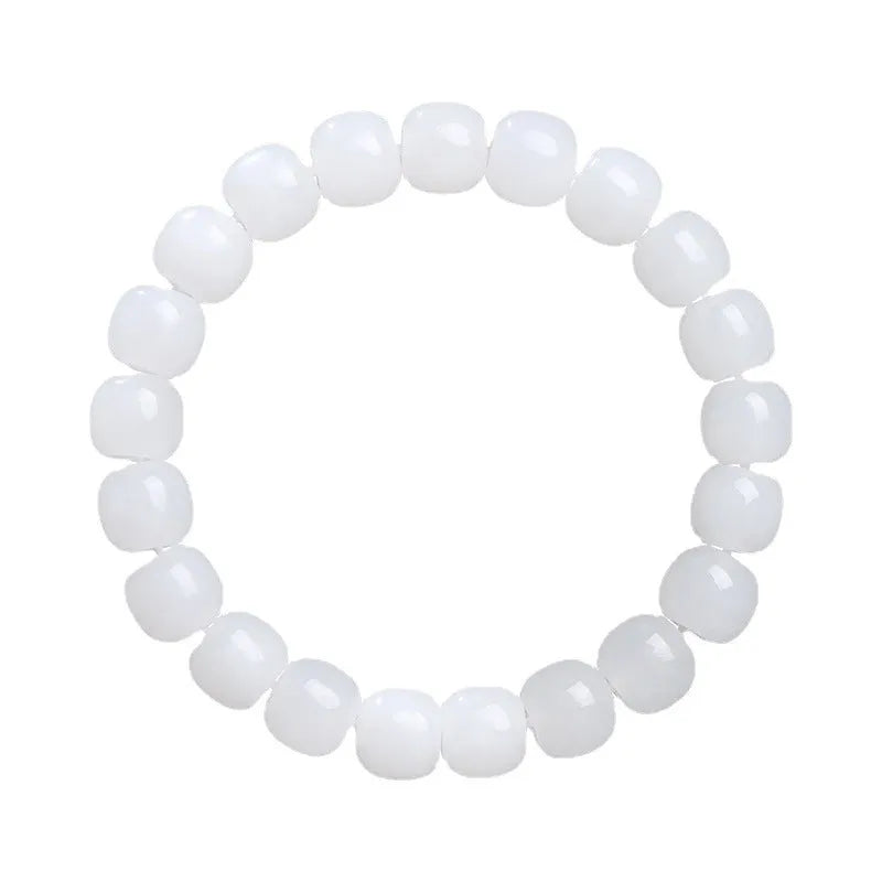 White Hetian jade barrel bead bracelet on a wrist, showing the unisex casual design.