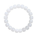 White Hetian jade barrel bead bracelet on a wrist, showing the unisex casual design.