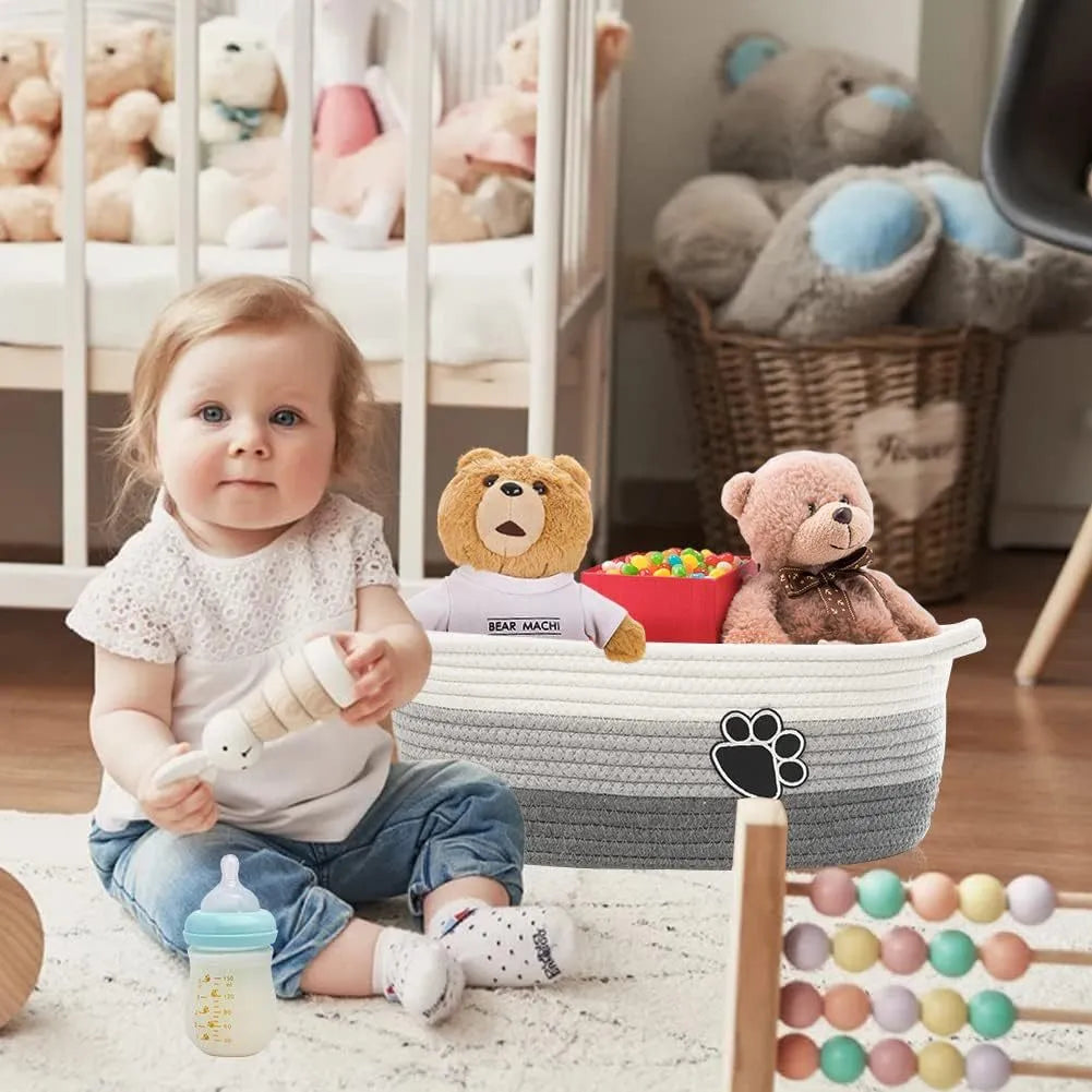 Light beige handmade woven cotton rope storage basket with wood handle, dimensions 34x26x15cm.
