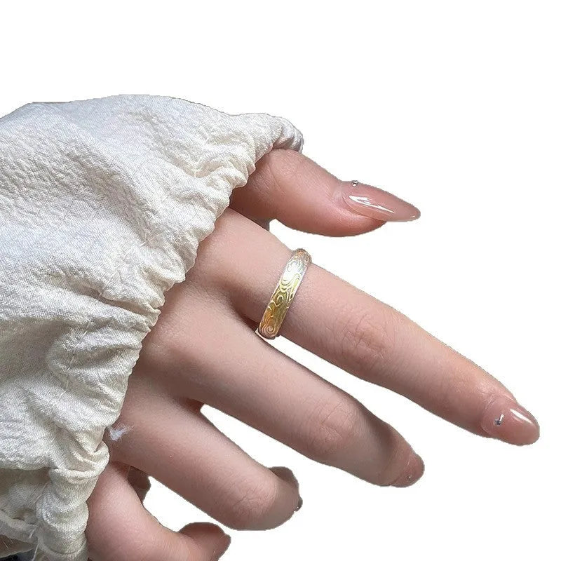 White copper open mouth ring with Xiangyun pattern and silver gold electroplated finish.