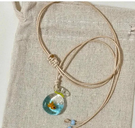 Women's necklace with a coloured glaze Joker pendant wearing a skirt on a cotton and linen chain.