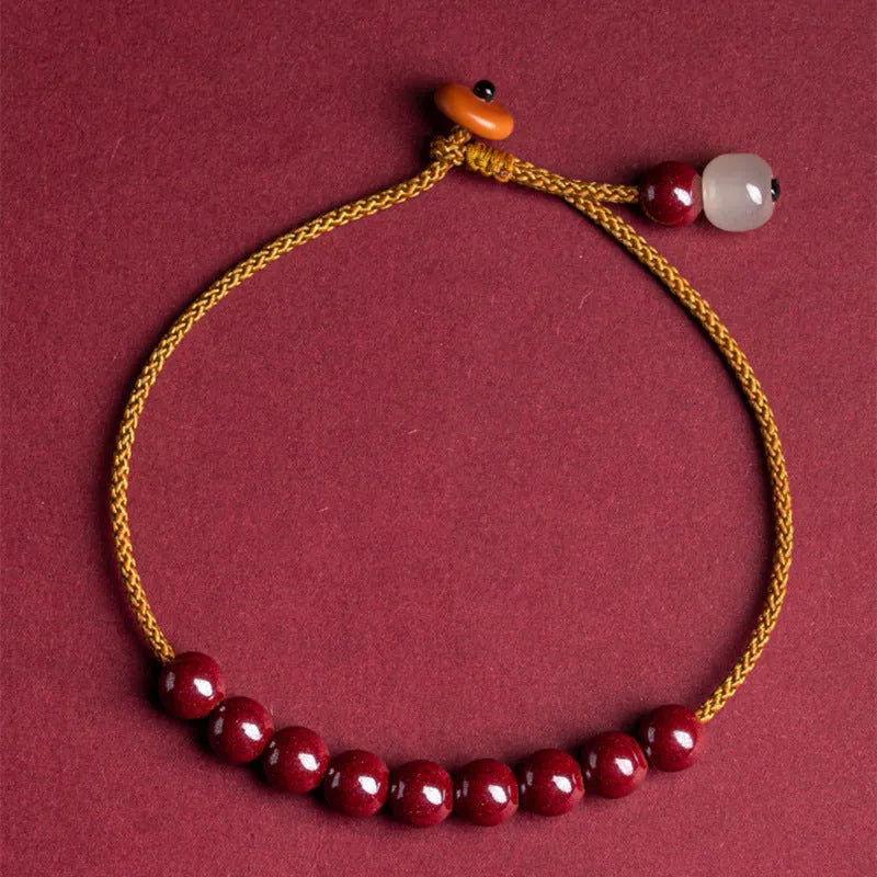 Hand-woven cinnabar geometric bracelet with a raw ore design.