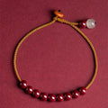 Hand-woven cinnabar geometric bracelet with a raw ore design.