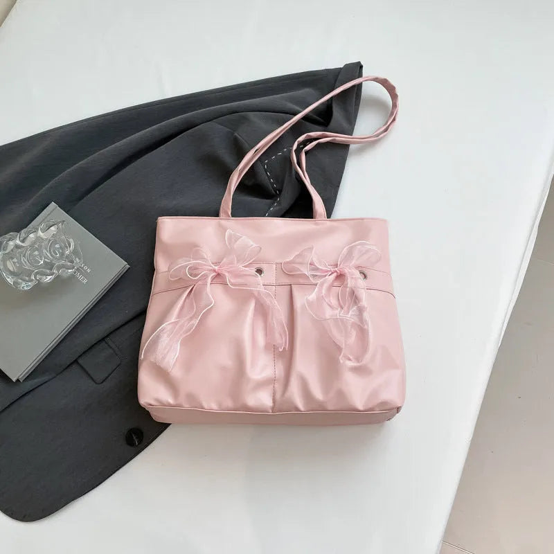 College style bow tote bag in black with large capacity, double shoulder straps, and zipper closure