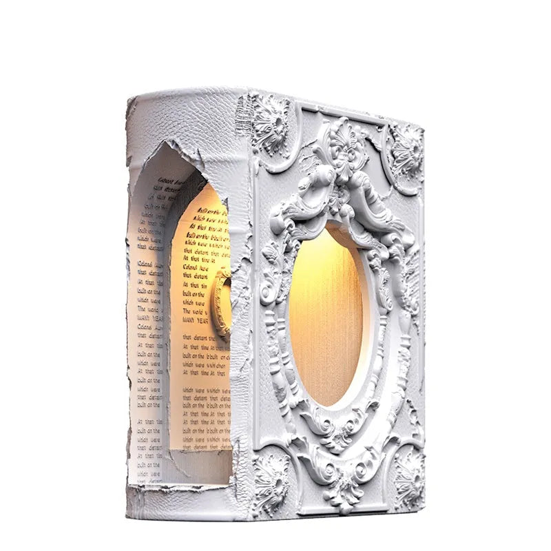Magic book gypsum table lamp with switch control on a bedside table