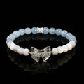Natural star pink crystal cat head bracelet on a woman's wrist