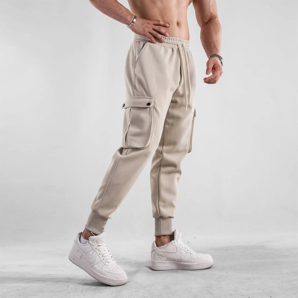 Men's loose cotton trousers with multiple pockets and adjustable ankle ties in solid colour options