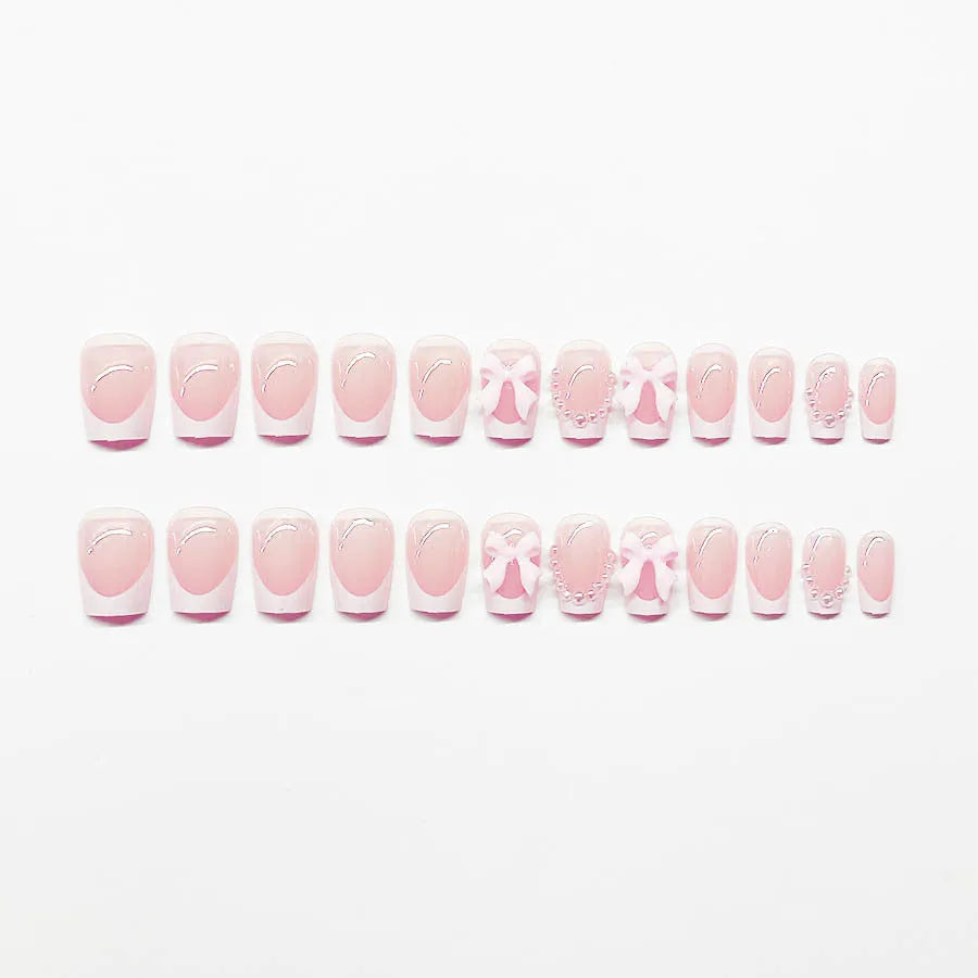 French manicure false nails with white bow design on short square nails with S274 adhesive glue