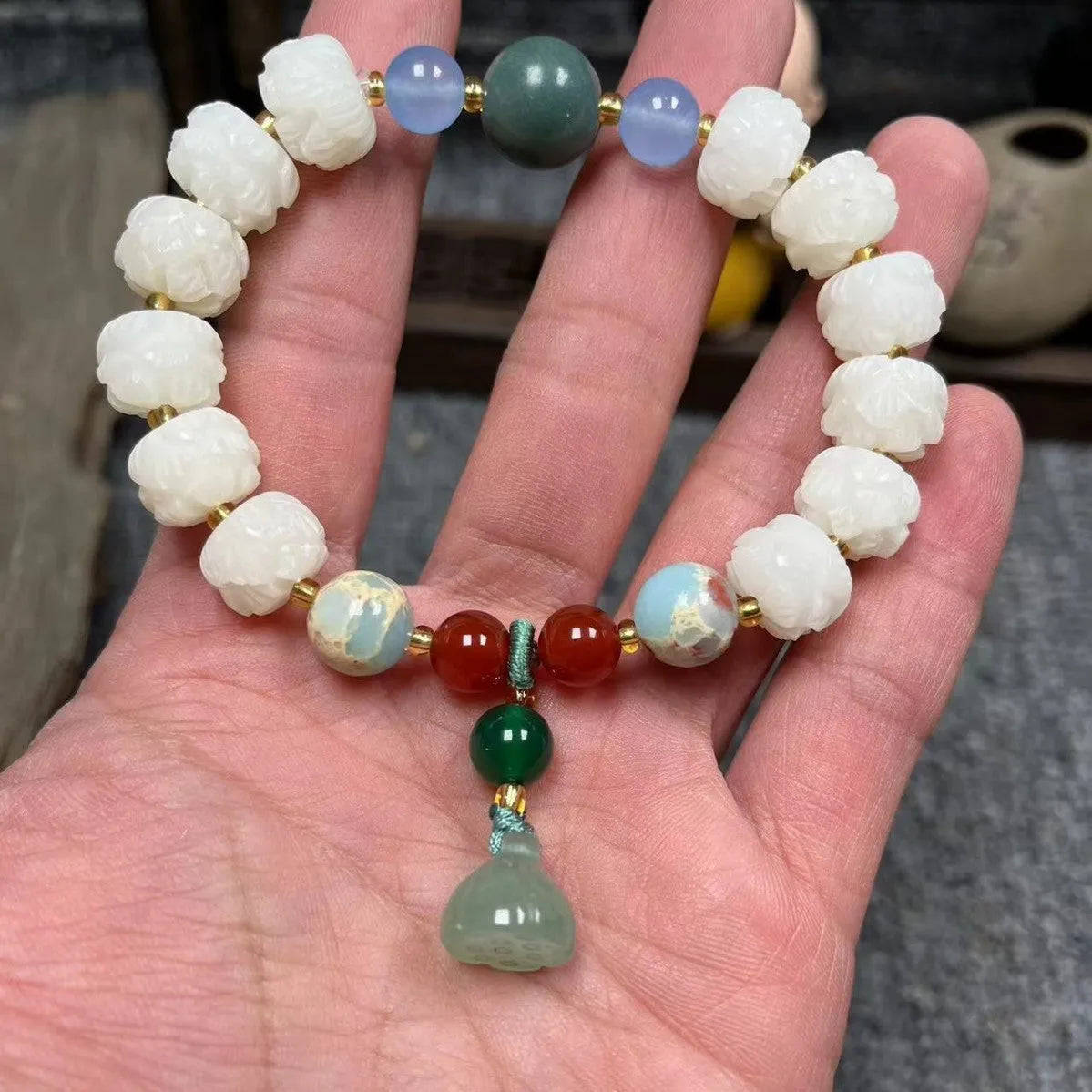 Bodhi root bracelet with carved lotus, pumpkin, and white jade beads in multiple sizes