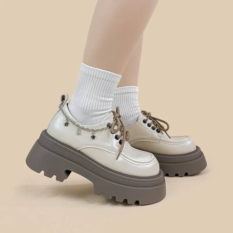 White women's platform Mary Jane shoes with chunky heel and front lace-up fastening.