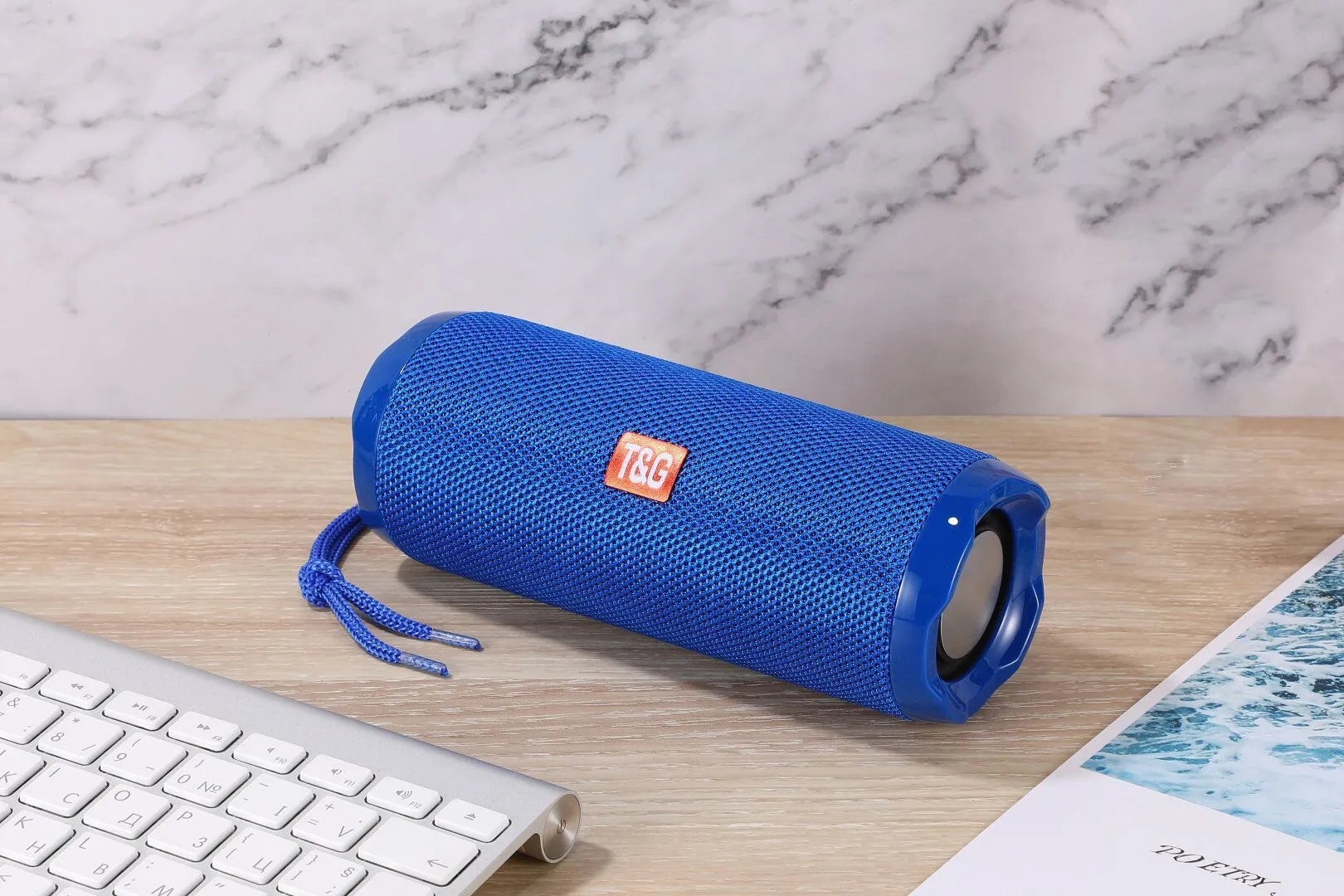 Fabric-covered portable Bluetooth speaker with integrated card holder in multiple colour options