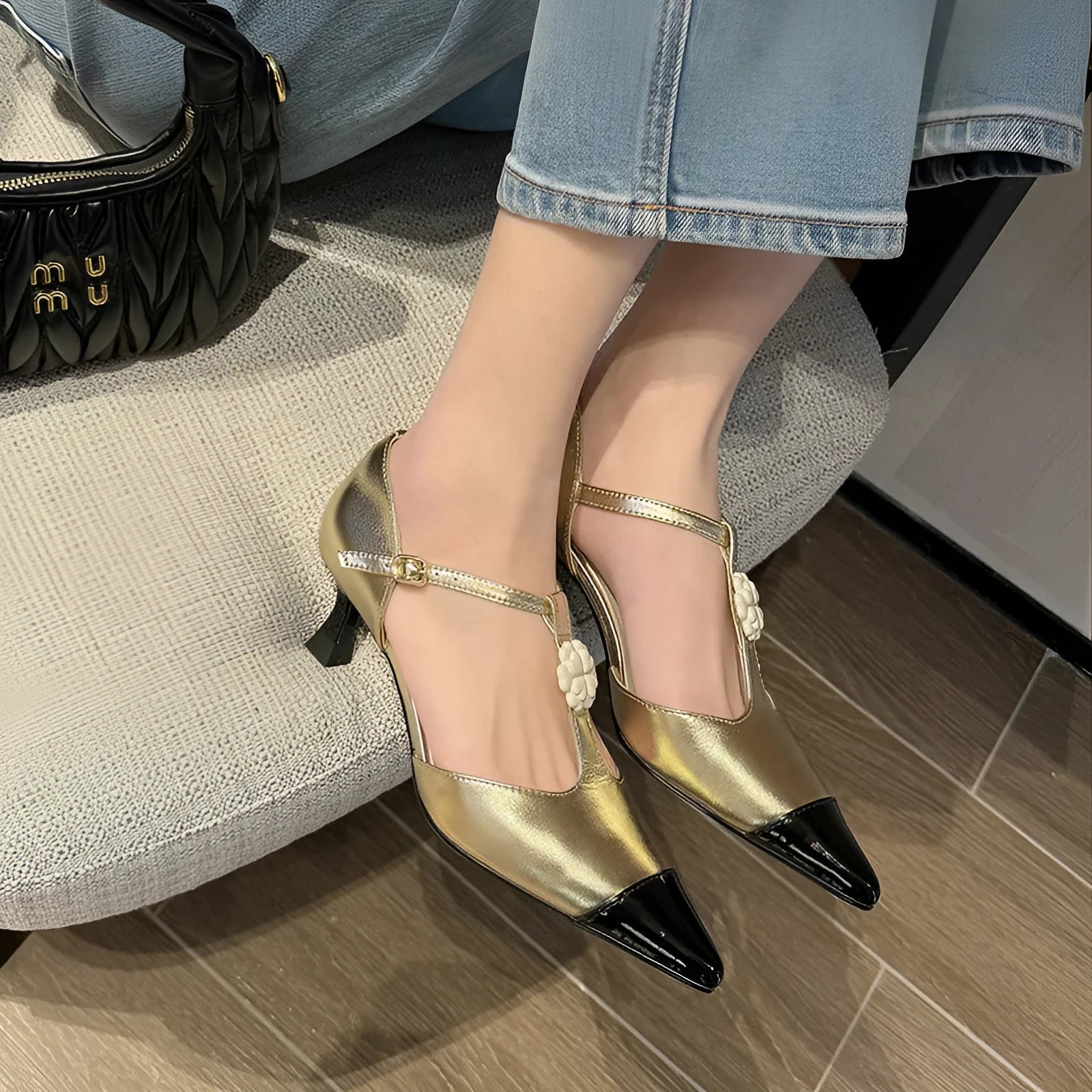 Women's pointed toe stiletto heel shoes with flower buckle decoration in shallow mouth cut style