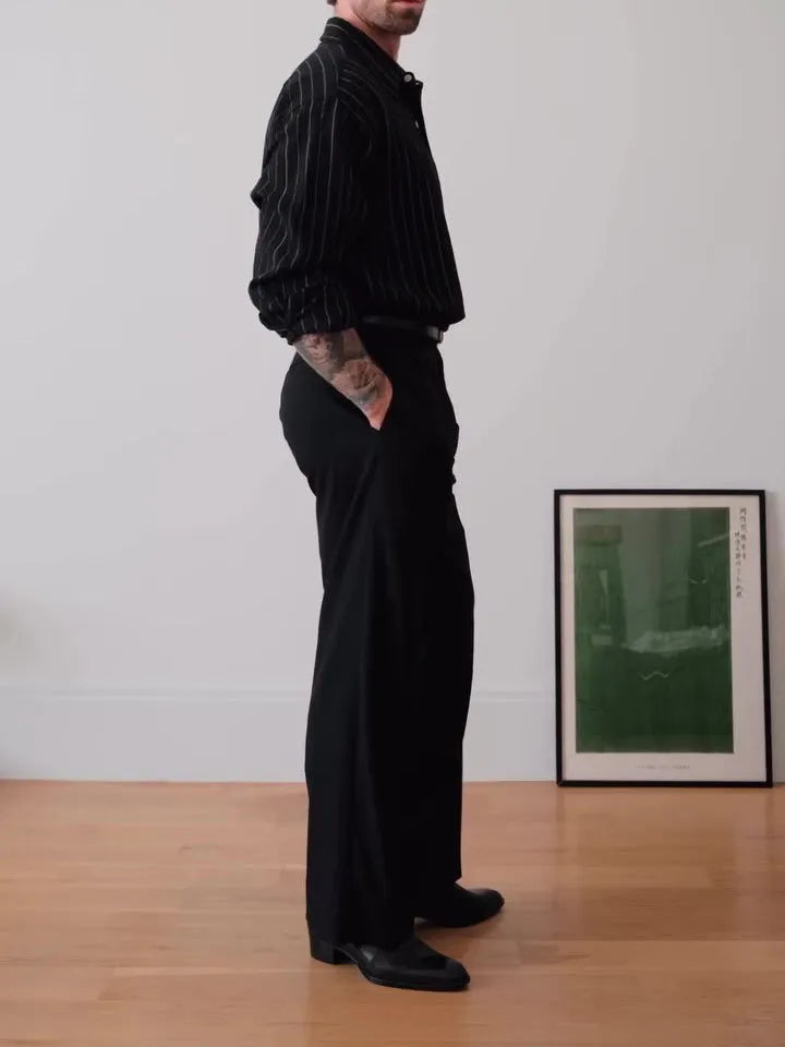 Black pinstriped button-down shirt with regular fit and striped pattern on polyester fabric