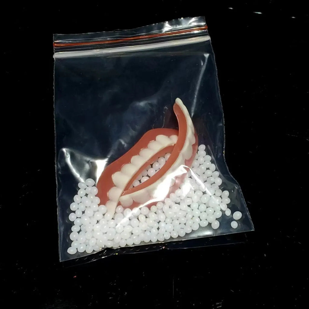 Silicone dental training dentures model showing upper and lower teeth simulation in tooth socket