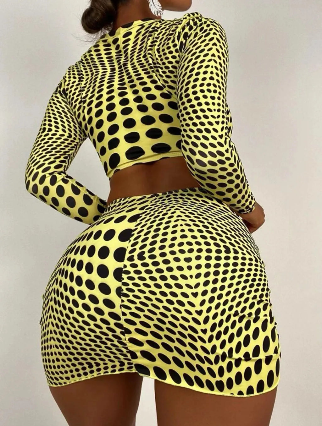 Women's green polka dot three-piece swimsuit set with top, skirt, and bra