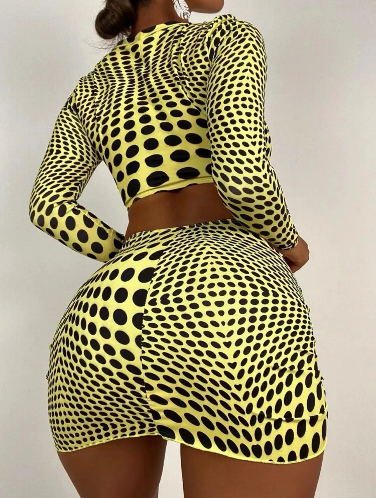 Women's green polka dot three-piece swimsuit set with top, skirt, and bra