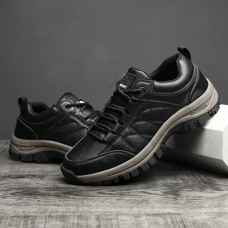 Men's black winter boots with plush lining, lace-up design, thick rubber sole, and round toe