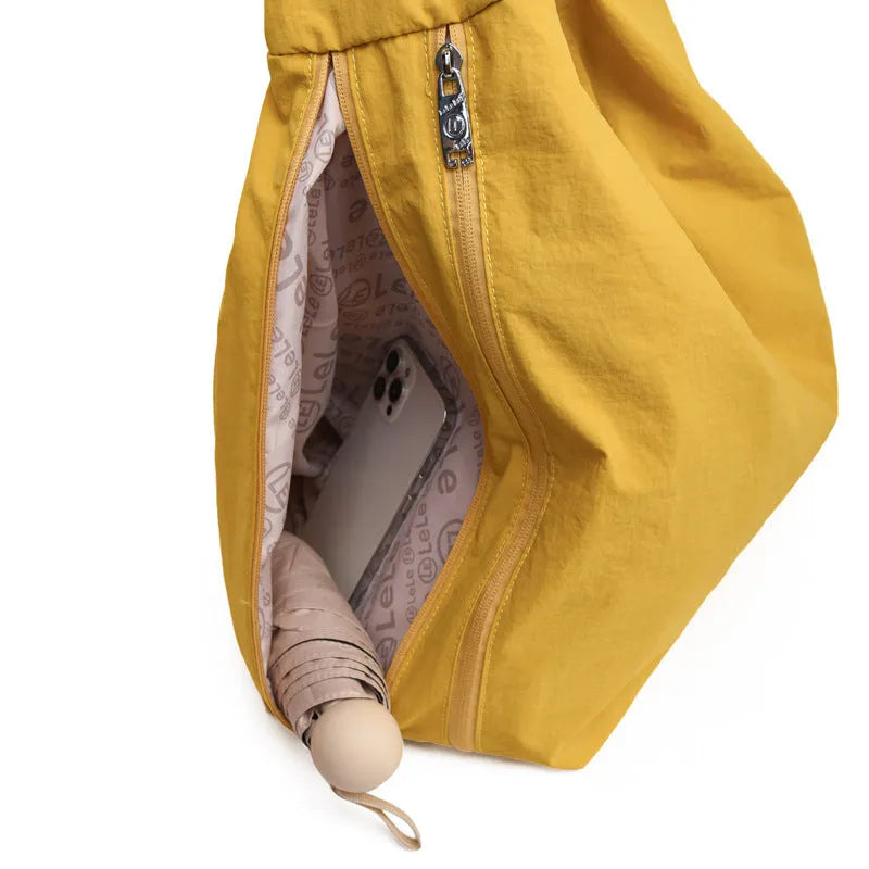 Soft nylon heart-shaped underarm bag for women in black, blue, khaki, or yellow.