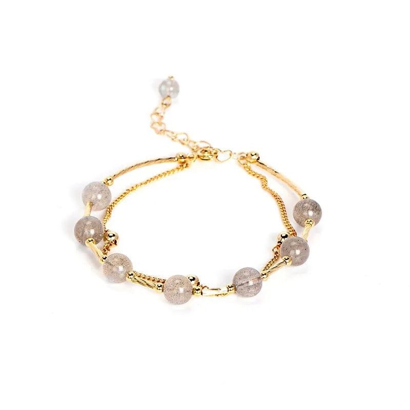 Crystal bracelet with double-layer copper tube and moonstone finish on white background
