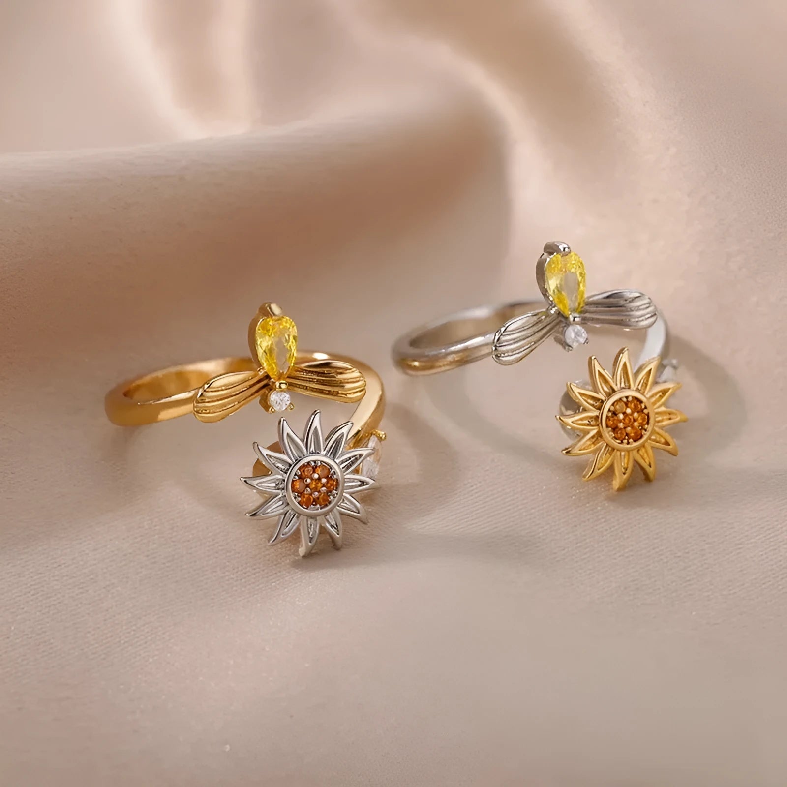 Simple gold adjustable spinner ring with rotating geometric component on a finger.