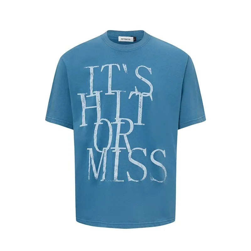 Men's blue cotton blend t-shirt with printed letter design showing loose fit and round neck