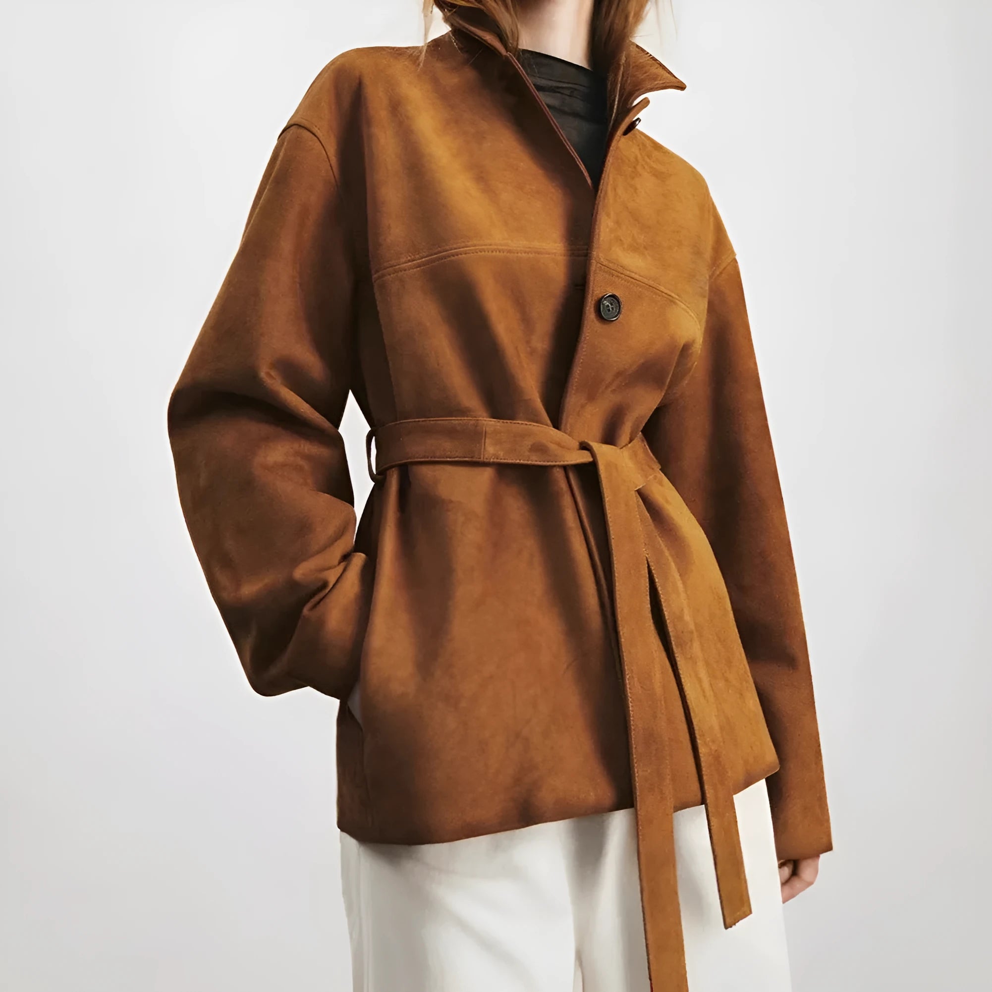 Yellow brown retro cashmere coat with Peter Pan collar, belt, and leather stitching detail.