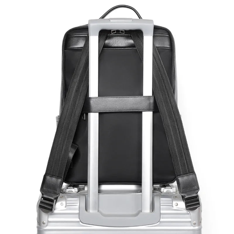 Men's black genuine leather laptop backpack with woven detail and large 36-55L capacity.
