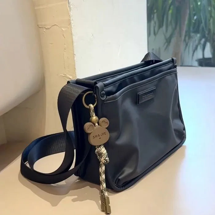 Unisex casual retro crossbody bag in Oxford cloth, small square shape, cool trendy style, single bag without ornaments