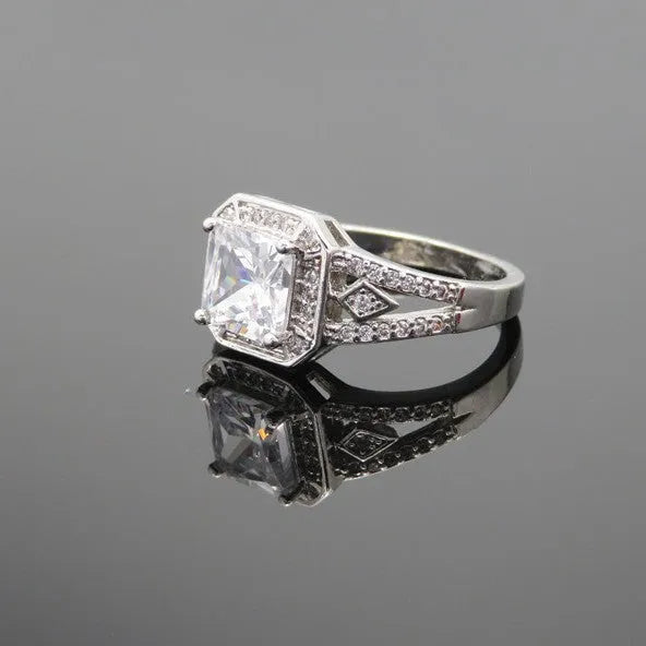 Geometric zircon ring with hollow quadrilateral design in platinum colour on copper band