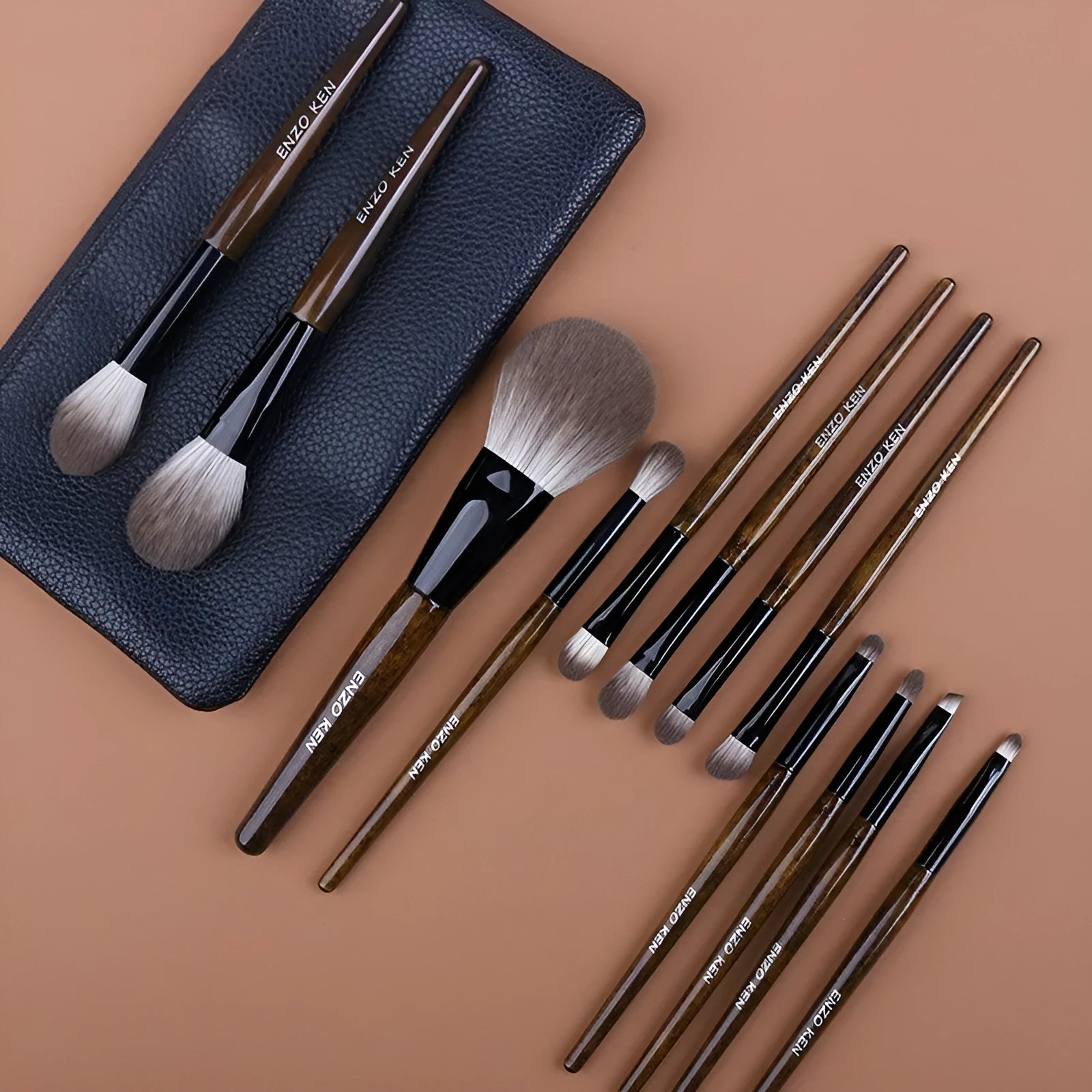 12-piece makeup brush set with wooden handles stored in a black PU zip bag
