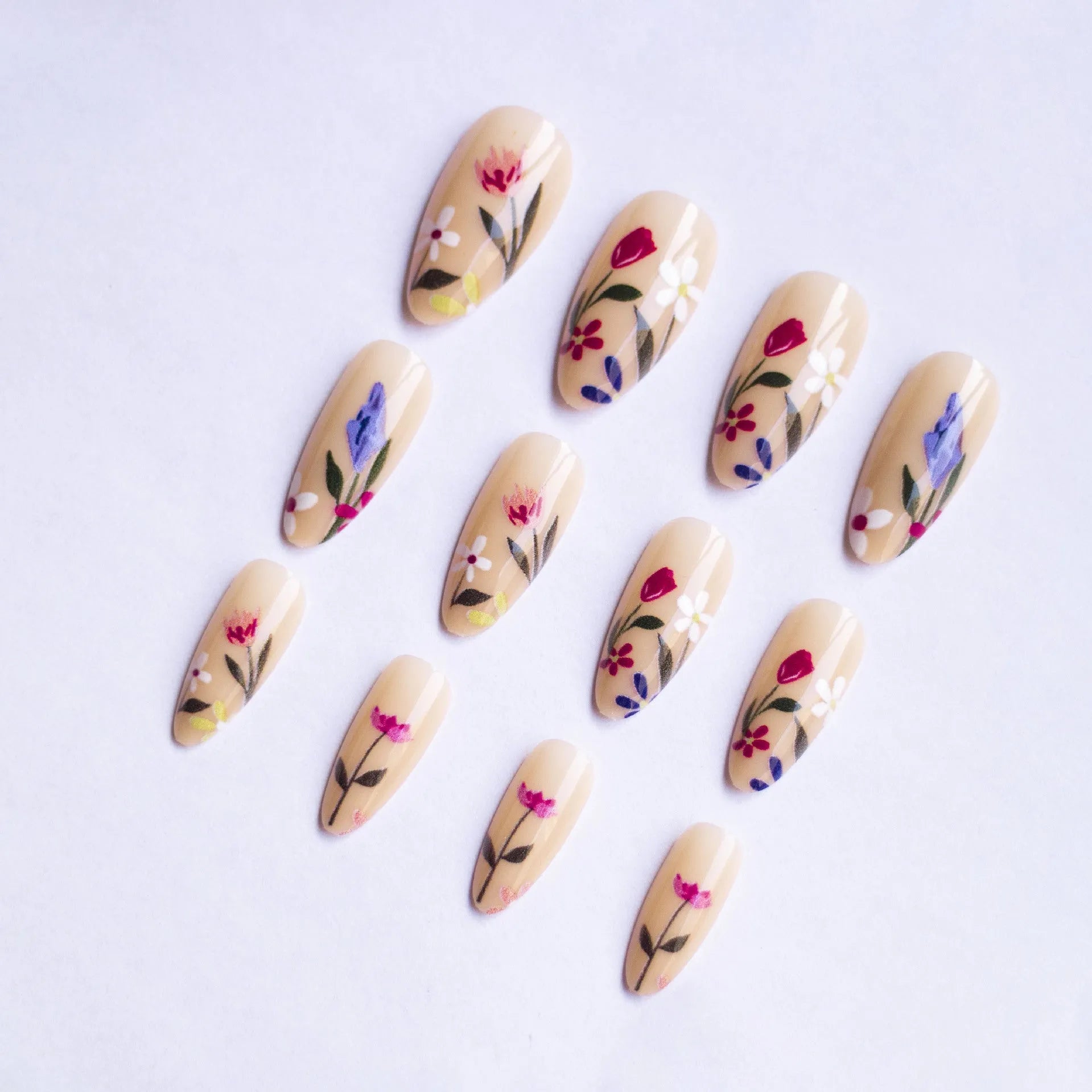 Almond-shaped removable wearable nail art set with rose and tulip flower patterns in solid colour